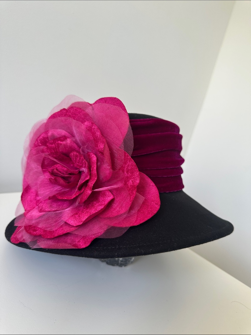 Black Wide-Brim Hat with Fuchsia Floral Accent